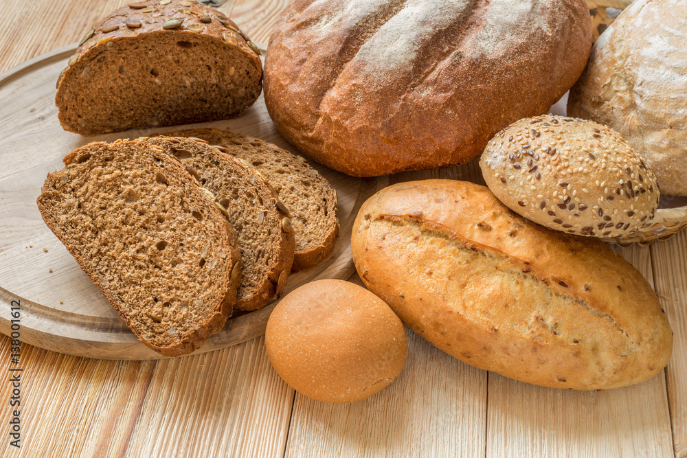 Fresh fragrant bread on the wooden table. Fresh fragrant bread on the wooden table.