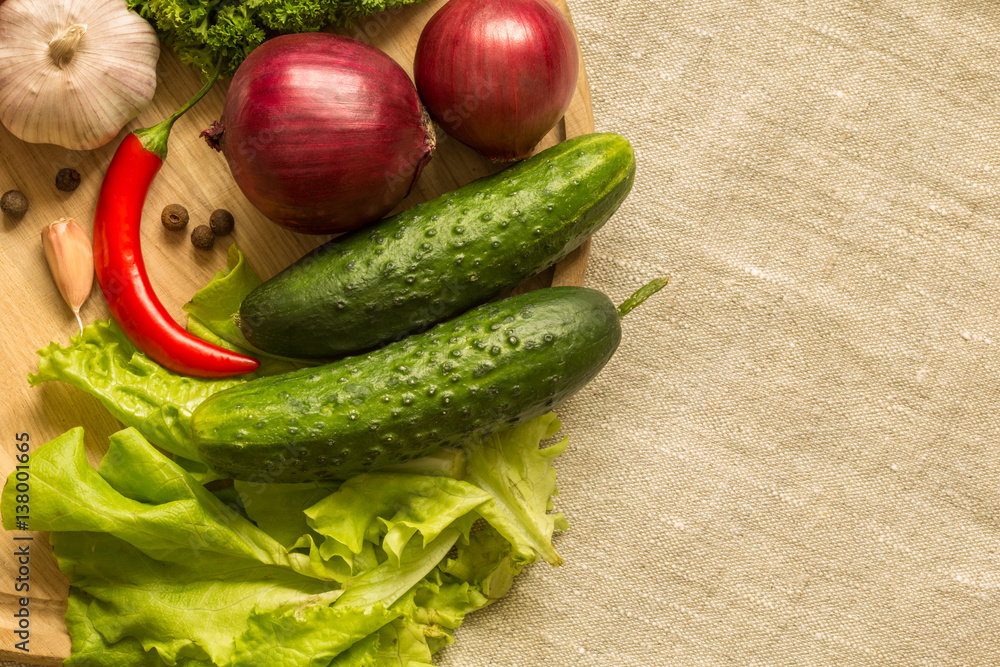 raw vegetables on a round wooden Board. top view. Space for text raw vegetables on a round wooden Board. top view. Space for text