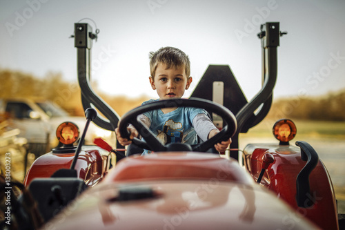 Portrait of boy sitting on quadbike