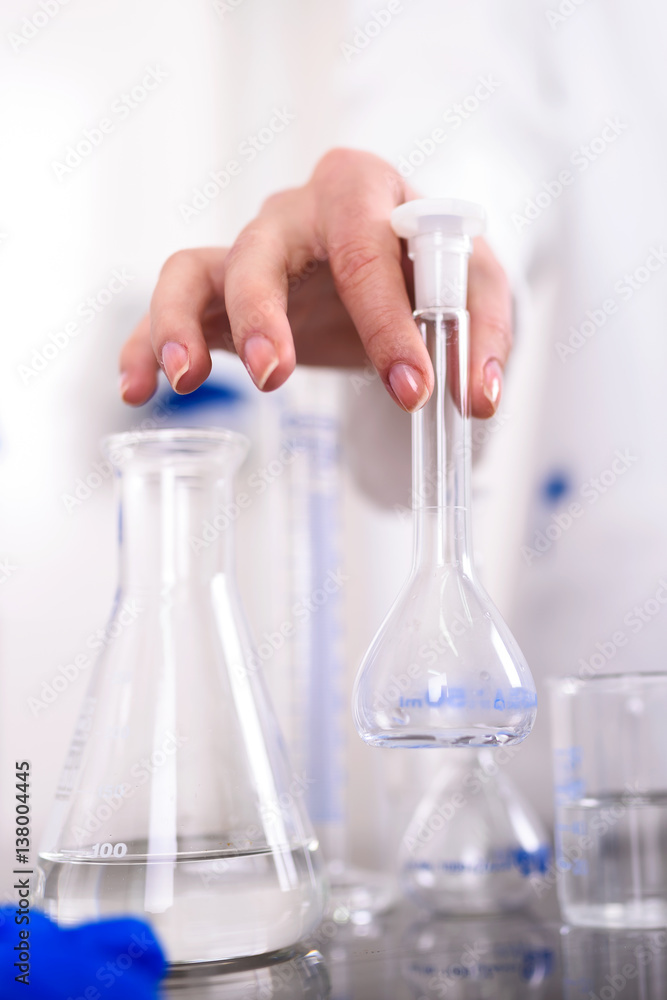 Hand of a Scientist Holds Laboratory Glassware Hand of a Scientist Holds Laboratory Glassware