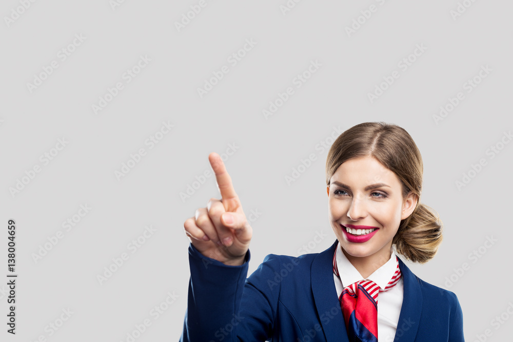Elegant female pointing virtual screen. Woman touch the button Elegant female pointing virtual screen. Woman touch the button