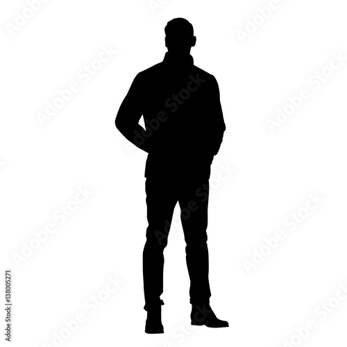 Standing man in jacket with hands in pockets, vector silhouette