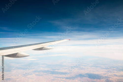 Wing of aeroplane flying in the sky