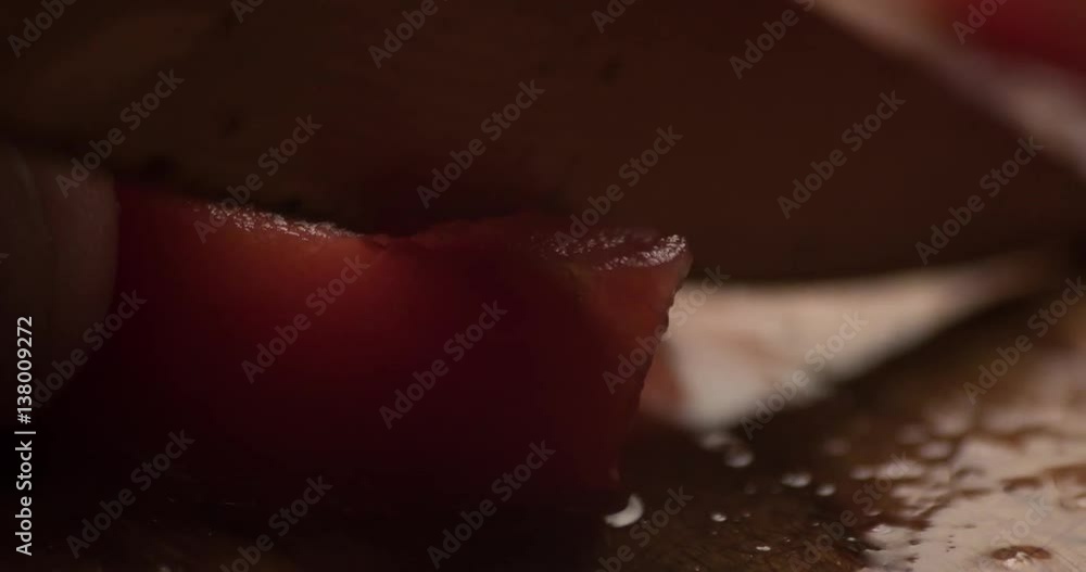 Tomato slicing slowmotion close up Tomato slicing slowmotion close up