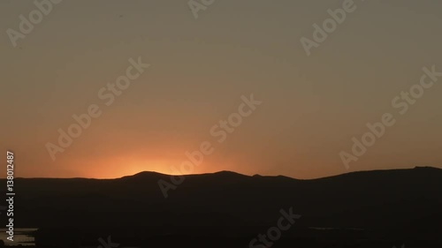 Wallpaper Mural Time lapse of sun rising over hillside, emitting an awesome explosion of light. Reverse to use as sunset. Torontodigital.ca