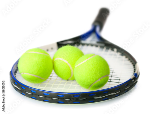 tennis balls and racket isolated on white background 