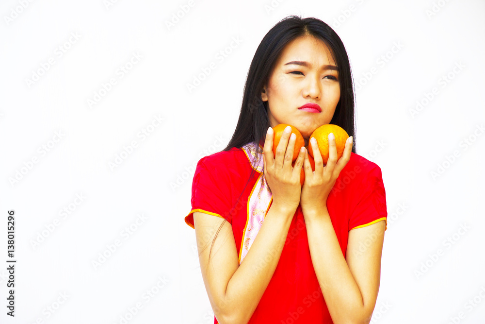 Chinese woman wears red dress is smiling on white background. Chinese woman wears red dress is smiling on white background.