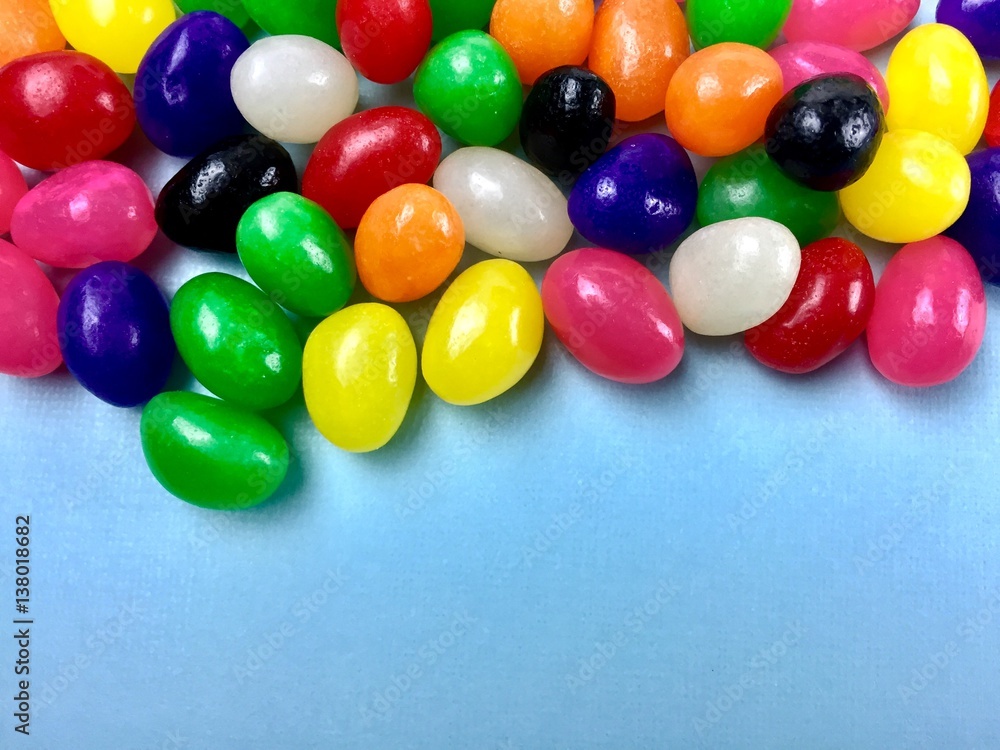 Jelly beans on a light blue background with copy space Jelly beans on a light blue background with copy space