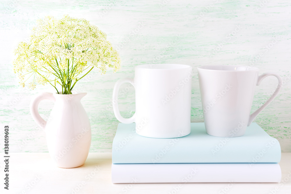 White coffee and latte mugs mockup with wild flowers