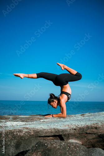 Asian woman yoga on the beach