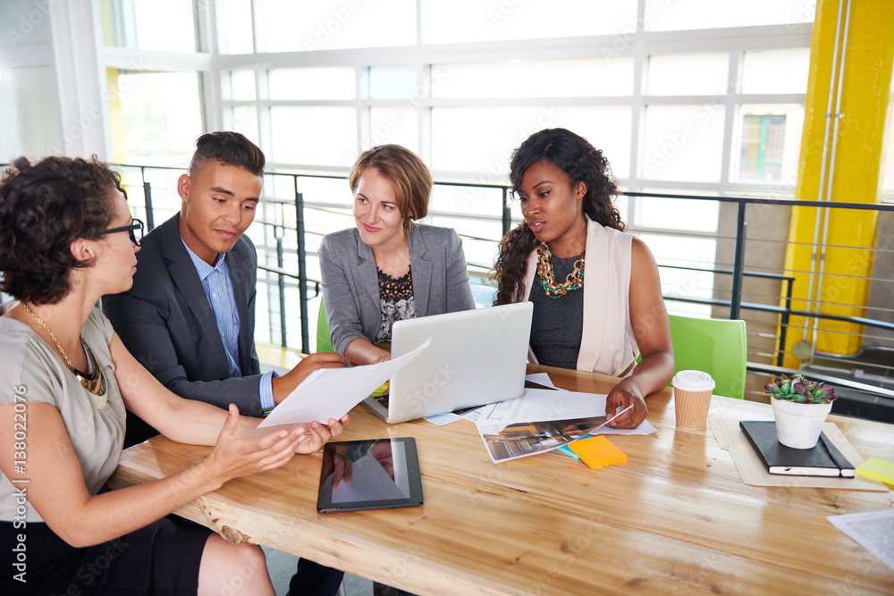 team of successful business people having a meeting in executive sunlit office team of successful business people having a meeting in executive sunlit office