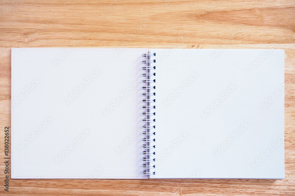 open notebook on wood table background open notebook on wood table background
