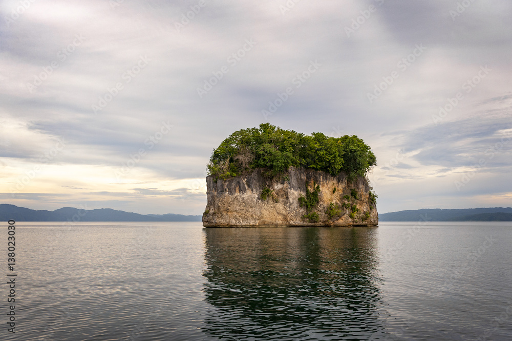 Kabui Bay,Raja Ampat, Indonesia. This small island is the rookery for the red billed parrot that return in the hundreds to roost at dusk. Kabui Bay,Raja Ampat, Indonesia. This small island is the rookery for the red billed parrot that return in the hundreds to roost at dusk.