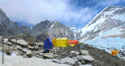 Everest Base Camp colored tents, at an altitude of 5,364 metres (17,598 ft). These camps are rudimentary campsites on Mount Everest that are used by mountain climbers during their ascent and descent. photo