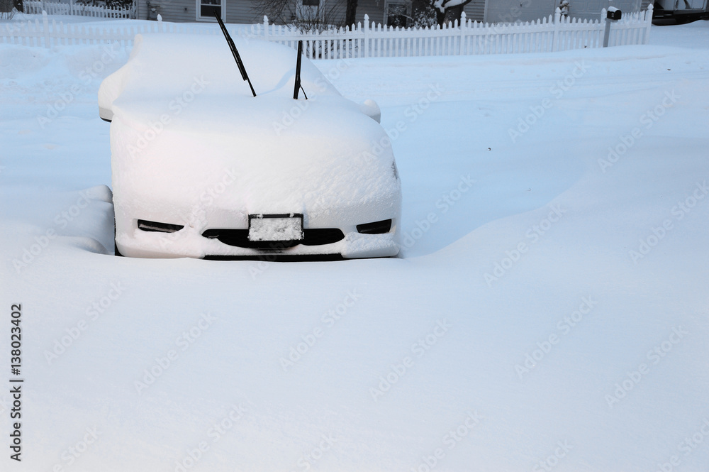 car covered by snow in blizzard car covered by snow in blizzard