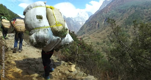 District Namche Bazar, Nepal- May 28, 2016: Carrying cargo in the Himalayas, Nepal, the trek to Everest Base Camp. 