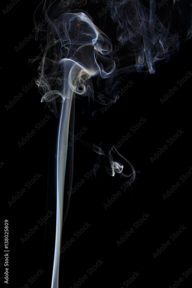 Abstract art. Color white blue smoke from the aromatic sticks on a black background. Background for Halloween. Texture fog. Design element. The concept of aromatherapy. Abstract art. Color white blue smoke from the aromatic sticks on a black background. Background for Halloween. Texture fog. Design element. The concept of aromatherapy.