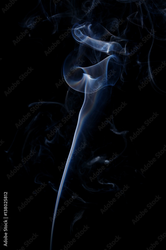Abstract art. Color white blue smoke from the aromatic sticks on a black background. Background for Halloween. Texture fog. Design element. The concept of aromatherapy. Abstract art. Color white blue smoke from the aromatic sticks on a black background. Background for Halloween. Texture fog. Design element. The concept of aromatherapy.