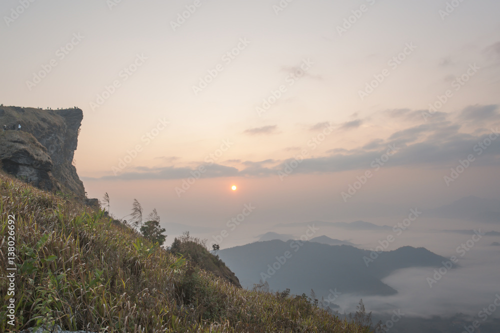 Sunrise scene with the peak of mountain and cloudscape at Phu chi fa in Chiangrai,Thailand Sunrise scene with the peak of mountain and cloudscape at Phu chi fa in Chiangrai,Thailand