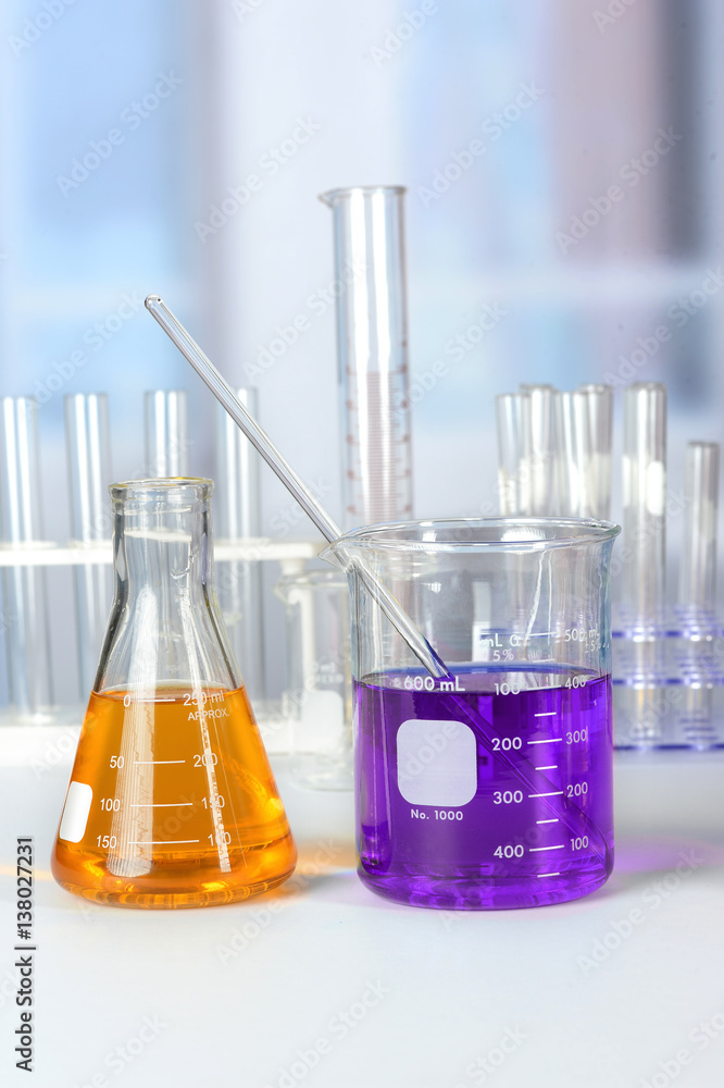 Laboratory Glassware on White Table Laboratory Glassware on White Table