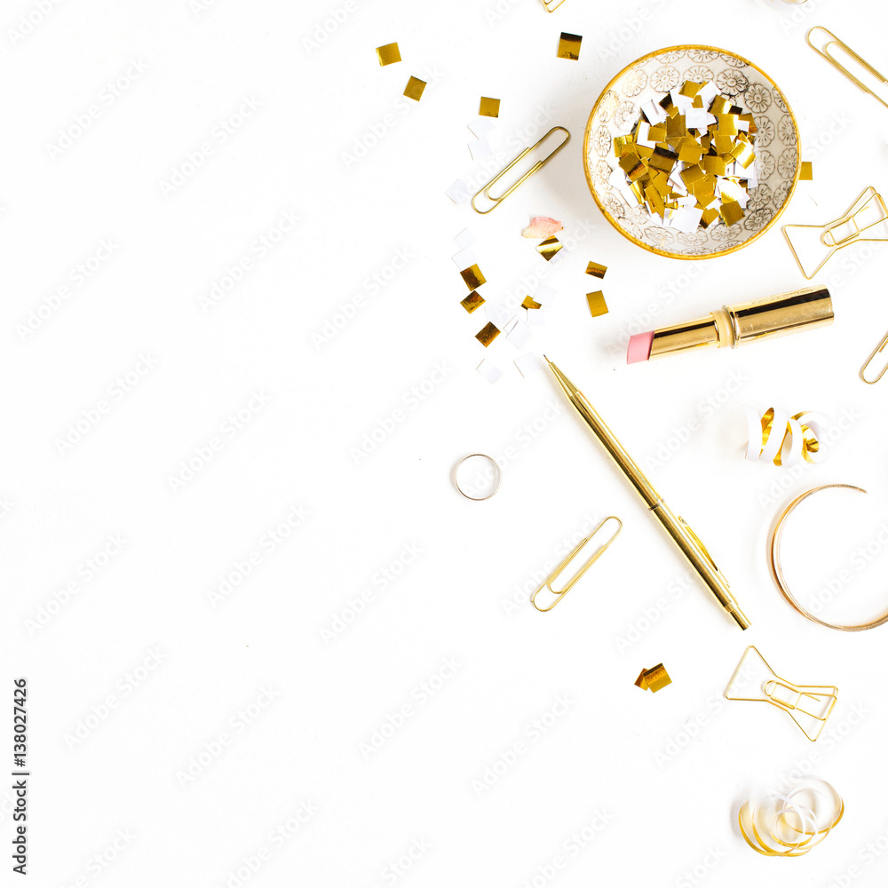 Beauty blog background. Gold style feminine accessories. Golden tinsel, scissors, pen, rings, necklace, bracelet on white background. Flat lay, top view. Beauty blog background. Gold style feminine accessories. Golden tinsel, scissors, pen, rings, necklace, bracelet on white background. Flat lay, top view.