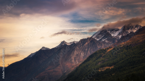 Mountainside with peaks shrouded in cloud