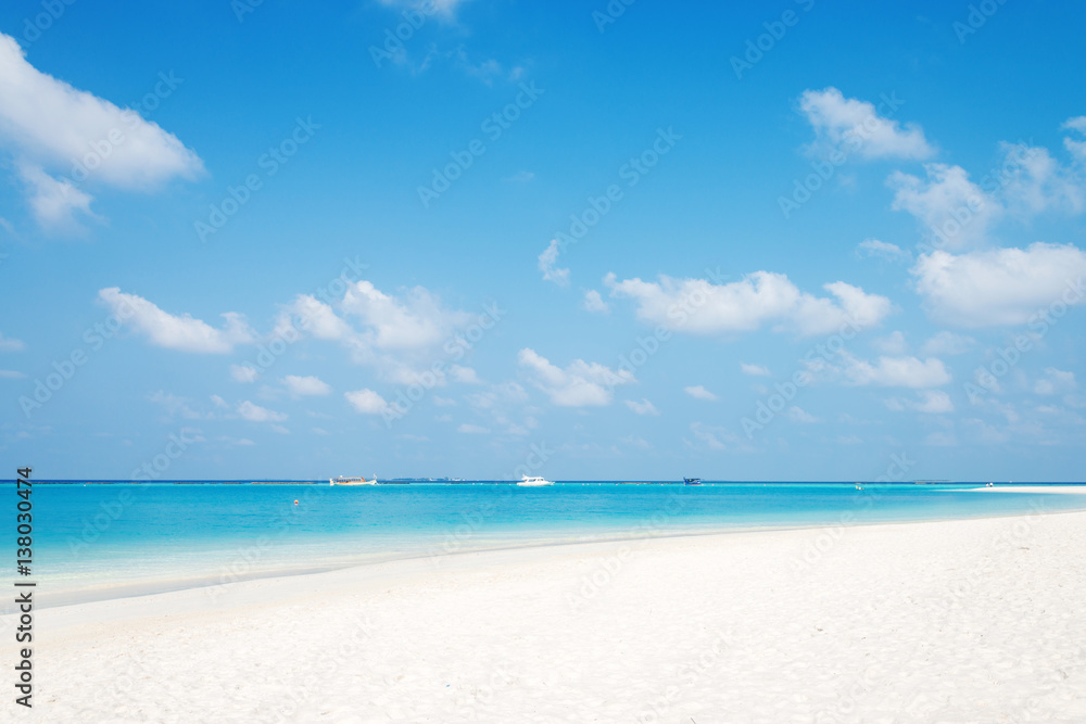beautiful tranquil beach in blue sunny sky