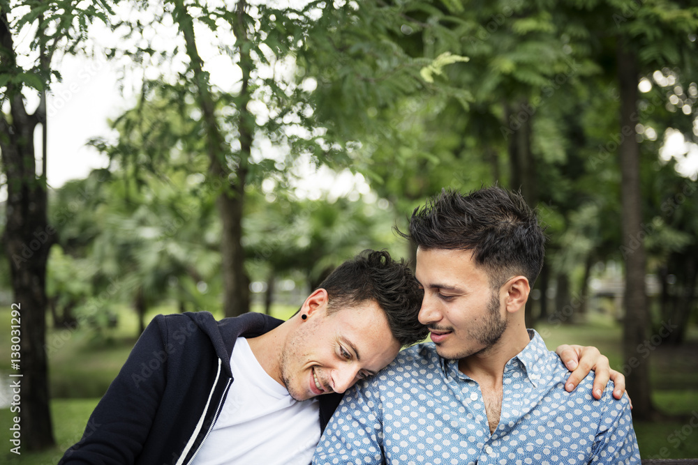 Young couple sitting in park