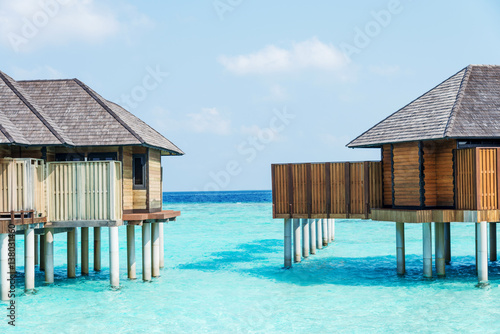 beautiful tropical sea with wood house in blue sky © zhu difeng