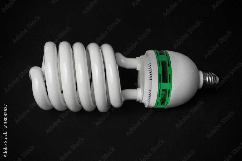 Energy saving fluorescent bulb on dark background Energy saving fluorescent bulb on dark background