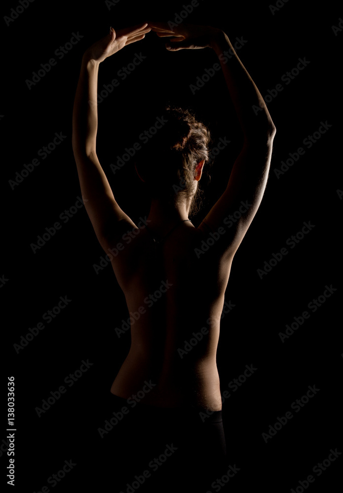 Obraz premium Elegant curves of female shoulders and neck, Redhead girl on a dark background