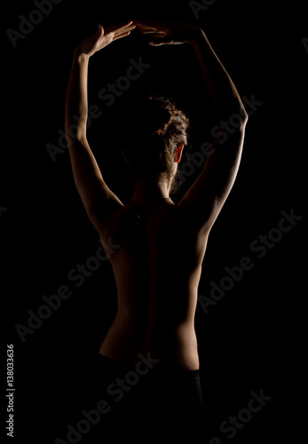 Elegant curves of female shoulders and neck, Redhead girl on a dark background © sandyche