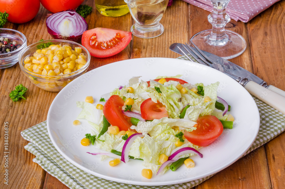 Salad with Chinese cabbage, tomatoes, corn, green beans and onion. Healthy dish. Salad with Chinese cabbage, tomatoes, corn, green beans and onion. Healthy dish.