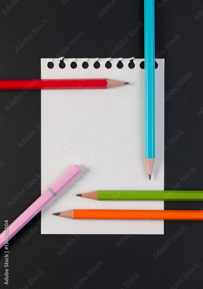 Close-up of business note paper. Template for blank note paper with colorful pencil for text and note. Top view Close-up of business note paper. Template for blank note paper with colorful pencil for text and note. Top view