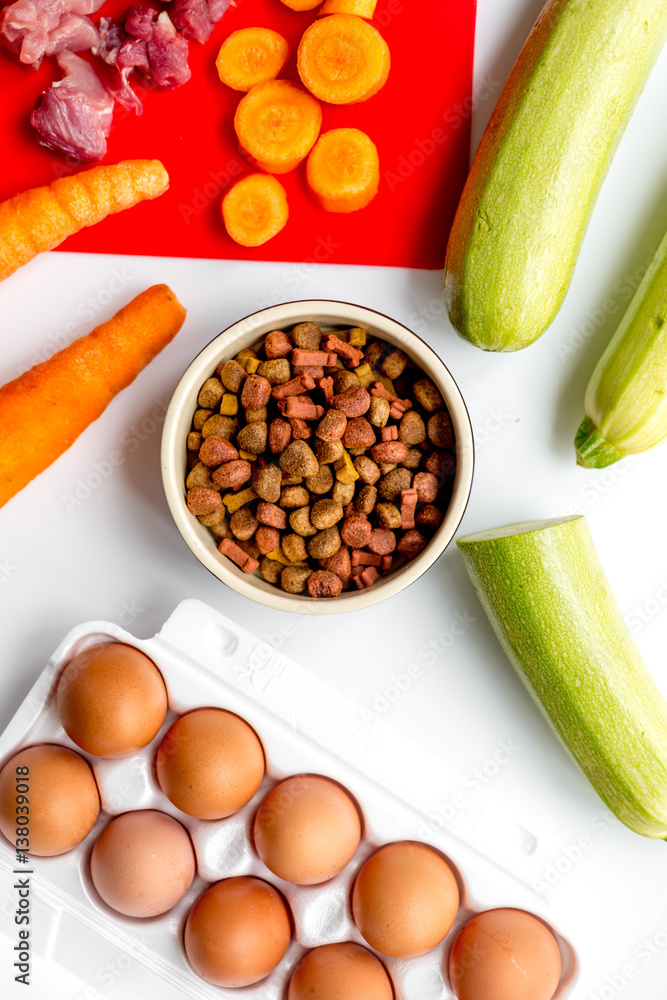 healthy dogfood with eggs, vegetables and meat on kitchen background top view healthy dogfood with eggs, vegetables and meat on kitchen background top view