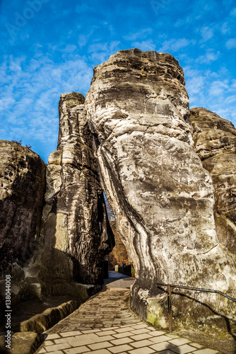 Natürliches Felsentor der Basteibrücke im Elbsandsteingebirge der sächsischen Schweiz in Deutschland photo