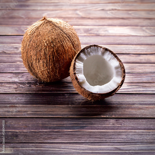 Coconuts on a dark wooden background