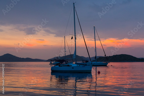 moored sailboats after the sunset, Kornati, Croatia