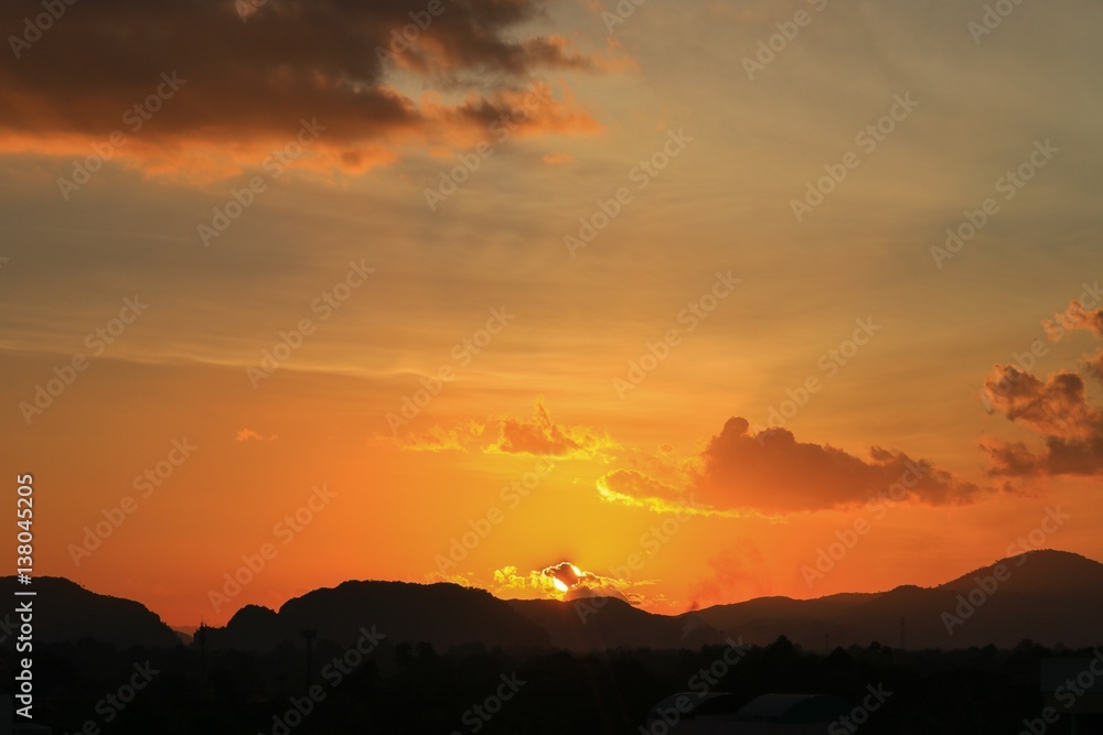 sky in sunset and motion cloud, beautiful colorful twilight time with mountain silhouette