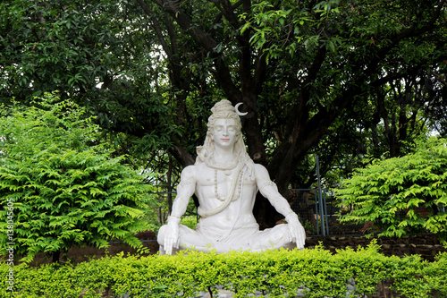 Statue of Hindu Lord Shiva under the tree, Rishikesh. India photo