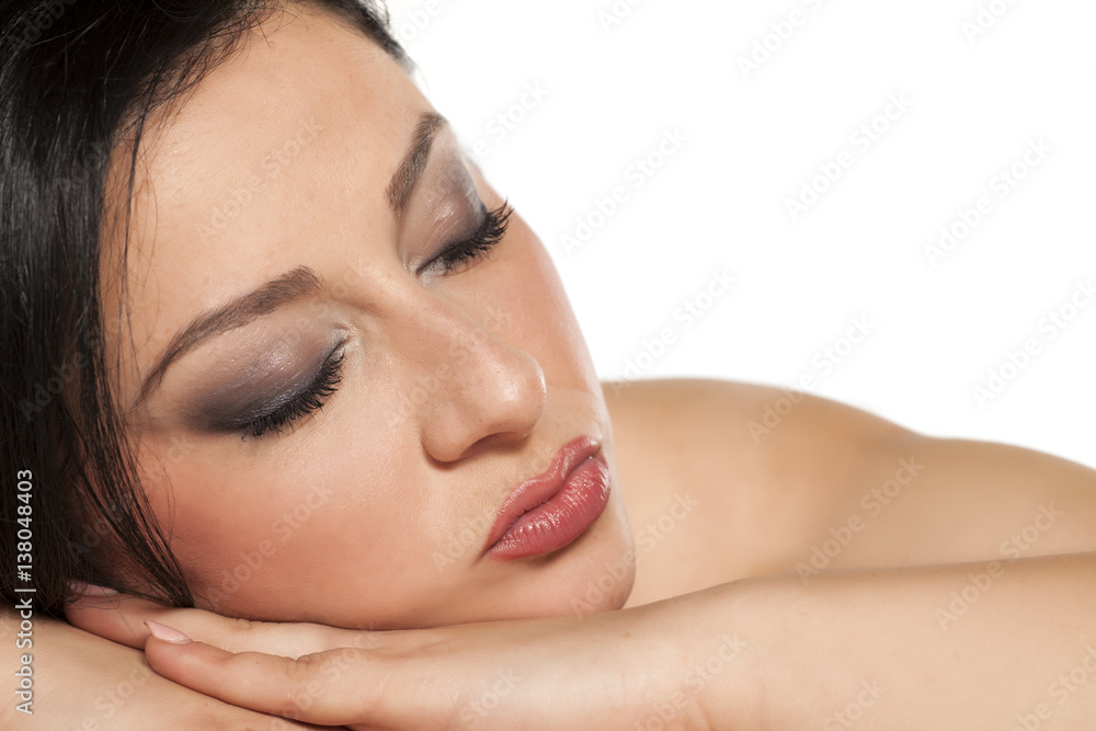 Naklejka premium portrait of a young lying beautiful woman