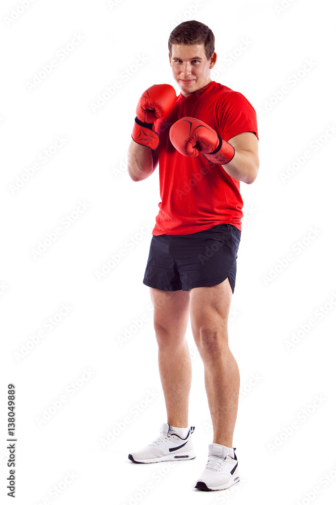 Full length portrait of young boxer making punch isolated on white background Full length portrait of young boxer making punch isolated on white background