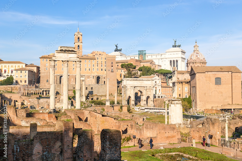 Rome, Italy. Roman Forum, from left to right: Temple of Castor and Pollux, temple of Saturn, Tabularium, Arch of Septimius Severus, Mamertinum, Temple of Vesta and house of Vestals, Curia Julia
