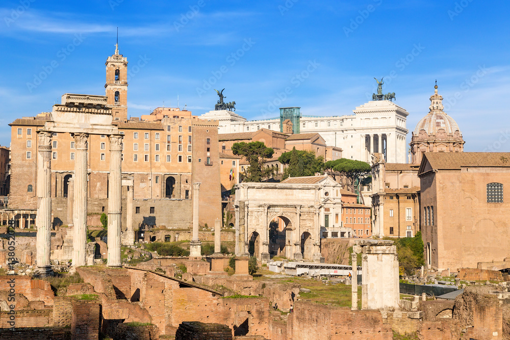 Rome, Italy. Roman Forum, from left to right: Temple of Castor and Pollux, temple of Saturn, Tabularium (Senators Palace), Arch of Septimius Severus, Mamertinum, temple of Vesta, Curia Julia