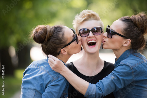 portrait of three young beautiful woman with sunglasses