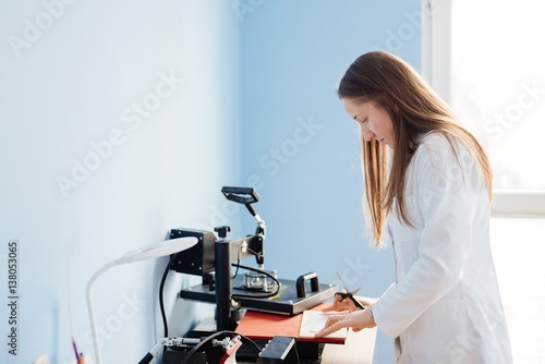 Woman in white lab thermal transferring image