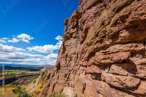 The sheer rock walls. Unusual shaped rocks on the background of blue sky. Beautiful landscape of yellow sharp cliffs. Smith Rock state park, Oregon
