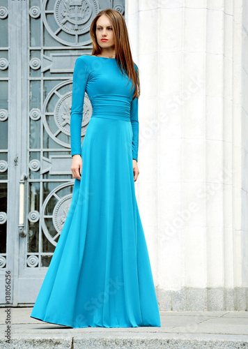 Fashionable woman in pretty blue dress