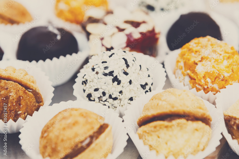 Different candies, cookies and biscuits on banquet table. Different candies, cookies and biscuits on banquet table.