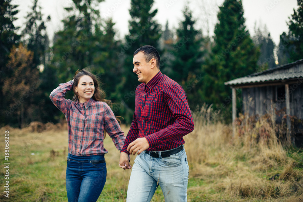 Fototapeta premium young beautiful hipster couple hiking in mountains